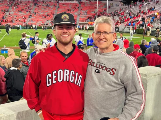 Two men at a Georgia Dogs football game